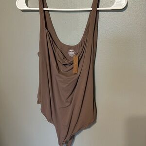 Skims bodysuit will mediums to 4x! Fits every body material color umber